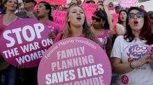 Planned Parenthood supporters attend a September rally in Los Angeles to campaign for access to reproductive health care.