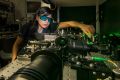 Rocio Camacho-Morales, a PhD candidate at the Australian National University.?Here she adjusts the laser equipment in ...