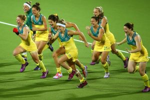 Celebration time: the Hockeyroos jubilant after Madonna Blyth scores the winning goal. 