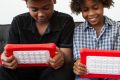 Rob Peete and Roman Peete display nabi, the tablet for children by Fuhu.