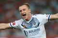 Melbourne Victory's Besart Berisha celebrates scoring one of three goals during the match between Western Sydney ...