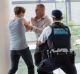 What not to do: a staged police image of a fight at an airport.