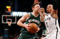 Milwaukee Bucks' guard Matthew Dellavedova drives past Brooklyn Nets' guard Randy Foye.