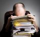 GENERIC - Series of an older businessman at desk. Stress in tray documents overworked tired.