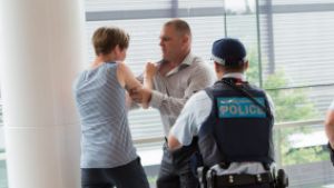 What not to do: a staged police image of a fight at an airport.