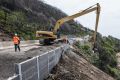 VicRoads is building a concrete retaining wall along the Great Ocean Road at Wye River to protect the road from likely ...