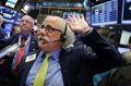 Trader Peter Tuchman works on the floor of the New York Stock Exchange.