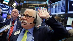 Trader Peter Tuchman works on the floor of the New York Stock Exchange.