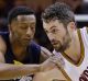 Kevin Love drives past Troy Williams.