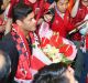 Worth weight in gold: Brazilian forward Hulk is surrounded by fans at the airport in Shanghai in June just before ...