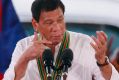 Philippine President Rodrigo Duterte gestures with a firing stance.