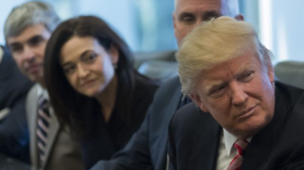 Donald Trump with (from left) Larry Page, Sherryl Sandberg and Mike Pence, listens in the direction of Tim Cook at the ...