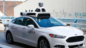 One of Uber's test self-driving cars on the road in Pittsburgh.