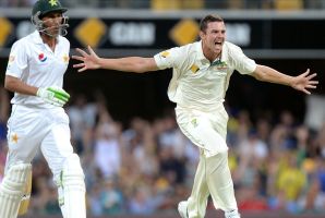 Howzat: Josh Hazlewood celebrates taking the wicket of Younis Khan.