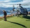 Extreme golf, anyone? A chopper conveys golfers to the green on Cecil Peak.