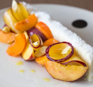 Flavours of summer: Coconut vanilla cake with stone fruit and almonds.