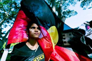 SYDNEY, AUSTRALIA - DECEMBER 10: <13 year old Jenna-Lee Roberts of Doonside flys the Aboriginal flag at the front of the ...