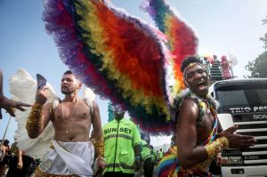 RIO DE JANEIRO, BRAZIL - DECEMBER 11: Revelers celebrate during the annual gay pride parade on Copacabana beach December ...