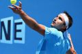 Marinko Matosevic serves to Luke Saville on Wednesday.