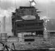 A British Army armoured vehicle makes its way along a barricade while on patrol in the Lower Falls area of west Belfast. ...