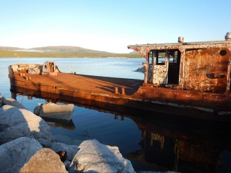 Even a rust bucket can look attractive in the right late evening light which we were lucky to encounter in Makkovik, ...
