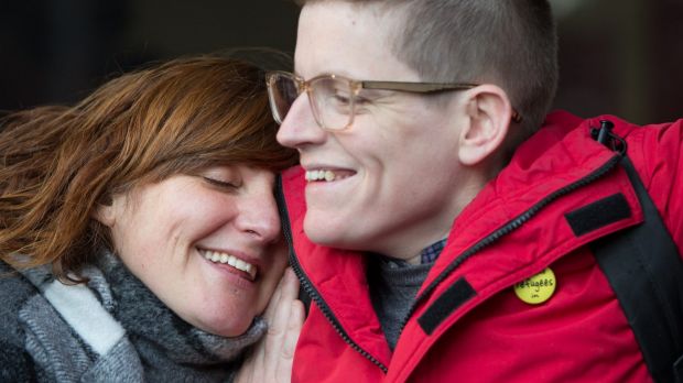 Roz Ward is hugged by a supporter on her return to work at La Trobe University in June.