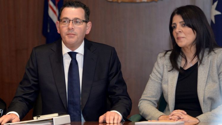 Consumer Affairs Minister Marlene Kairouz, seen with Premier Daniel Andrews, has continued the government's crackdown on underquoting.