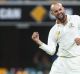 Breakthrough: Nathan Lyon celebrates dismissing Babar Azam.