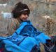 Children of eastern Aleppo sitting on the ground in western rural Aleppo, Syria.