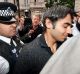 In disgrace: Salman Butt is escorted by police in London in 2010.