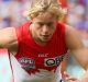 MELBOURNE, AUSTRALIA - OCTOBER 01: Caleb Daniel of the Western Bulldogs and Isaac Heeney of the Sydney Swans chase the ...