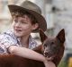 Levi Miller and Phoenix in <i>Red Dog: True Blue</i>.