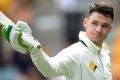 Peter Handscomb of Australia celebrates his hundred.