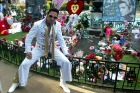 An Elvis impersonator pays his own kind of tribute to the King at Gracelands, which will be top of many travel lists in 2017.