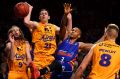 Congested: Darcy Harding and Jeromie Hill of the Kings compete for the ball with Jerome Randle.