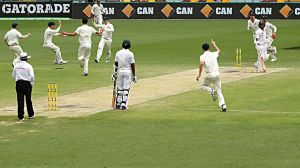 BRISBANE, AUSTRALIA - DECEMBER 19:  Steve Smith of Australia celebrates after running out Yasir Shah of Pakistan to ...