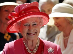 A selection of outfits worn by Britain's Queen Elizabeth go on display at her London Buckingham Palace residence as part of an exhibition marking the monarch's 90th birthday this year.