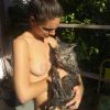 Caitlin poses naked with cat