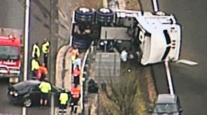 A truck lays on its side on the M1 at Beenleigh in October. A report has listed the Pacific Motorway among the nation's ...