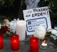 A message reading "Freedom on Earth" lays at a memorial for the victims of the Berlin terror attack.