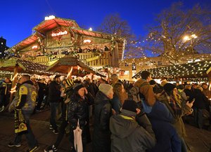 Thousands of people visit the Christmas market in Dortmund, Germany, Tuesday Dec. 20, 2016. A truck ran into a crowded Christmas market in Berlin the evening before and killed several people.