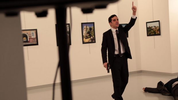 A man with a gun shouts inside the Ankara gallery as Russian ambassador to Turkey Andrei Karlov lies on the ground.