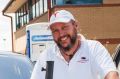 Tesla car owner, Slava Kozlovskii with members of the Canberra electric vehicle association, Peter Campbell and Mark ...