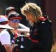 The Bombers' Dyson Heppell signs autographs during an Essendon training session on Tuesday.