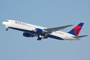 Delta Air Lines Boeing 767-300 during takeoff. The Boeing 767 is a mid-size, wide-body twin-engine jet airliner built by Boeing Commercial Airplanes.