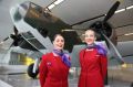 Virgin Australia staff with the Australian War Memorial's Lockheed Hudson bomber now on display at Canberra Airport.