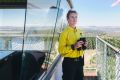 Seasonal firefighter Kirsty Babington at the Kowen Forest fire tower overlooking Canberra's surrounds.