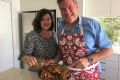 Opposition leader Tim Nicholls and his wife Mary making the Christmas supply of Nuts and Bolts.