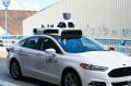 One of Uber's test self-driving cars on the road in Pittsburgh
