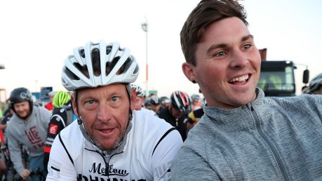 A local takes a selfie with Lance Armstrong.